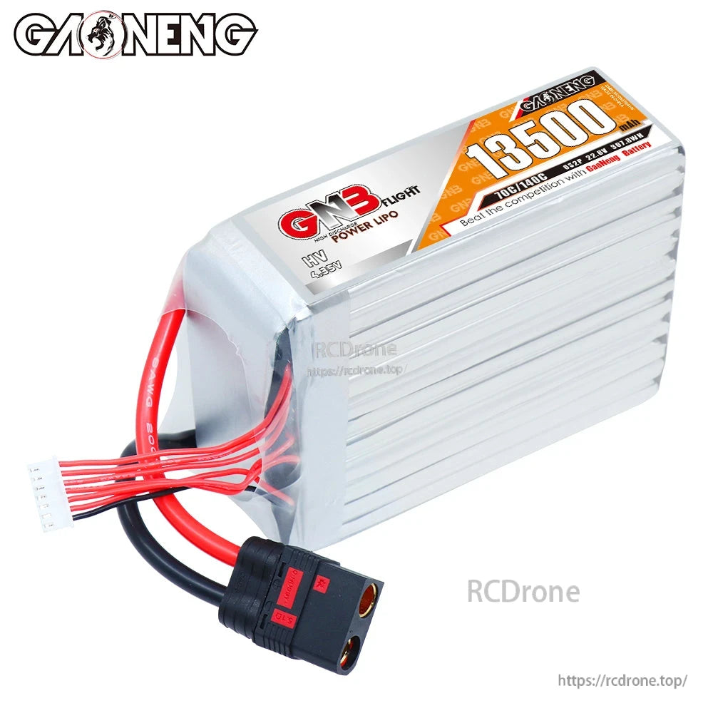 Angled top view of GNB 13500mAh HV LiPo battery showing wires, balance plug, and QS8 connector