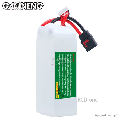 Rear view showing green safety warning label on GAONENG battery, with QS8 discharge cable