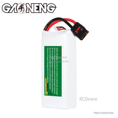 Rear side of GAONENG GNB LiPo battery showing green safety warning label and lead wires