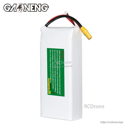 Rear view of LiPo battery with green safety warning label and power leads at top