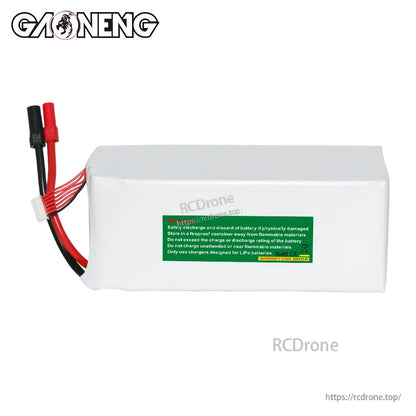 Side view of GAONENG GNB LiPo battery showing safety warning label and output/balance leads