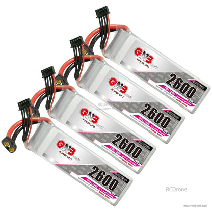 Four GNB 2600mAh LiPo batteries arranged diagonally, label side visible with leads