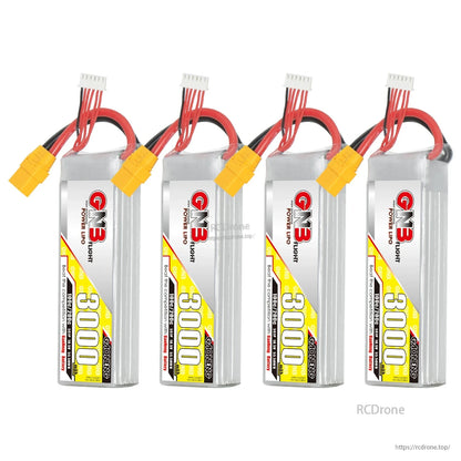 Four-pack display of GNB 3000mAh LiPo batteries lined up with XT90 connectors