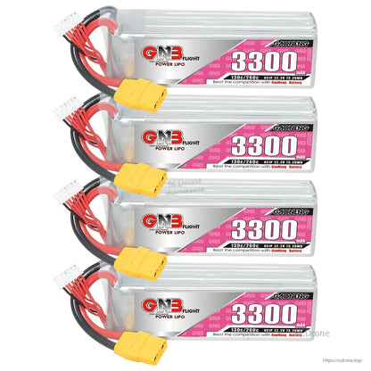 Four GNB 3300mAh LiPo packs stacked, showing labels, XT90 power leads and white balance connectors