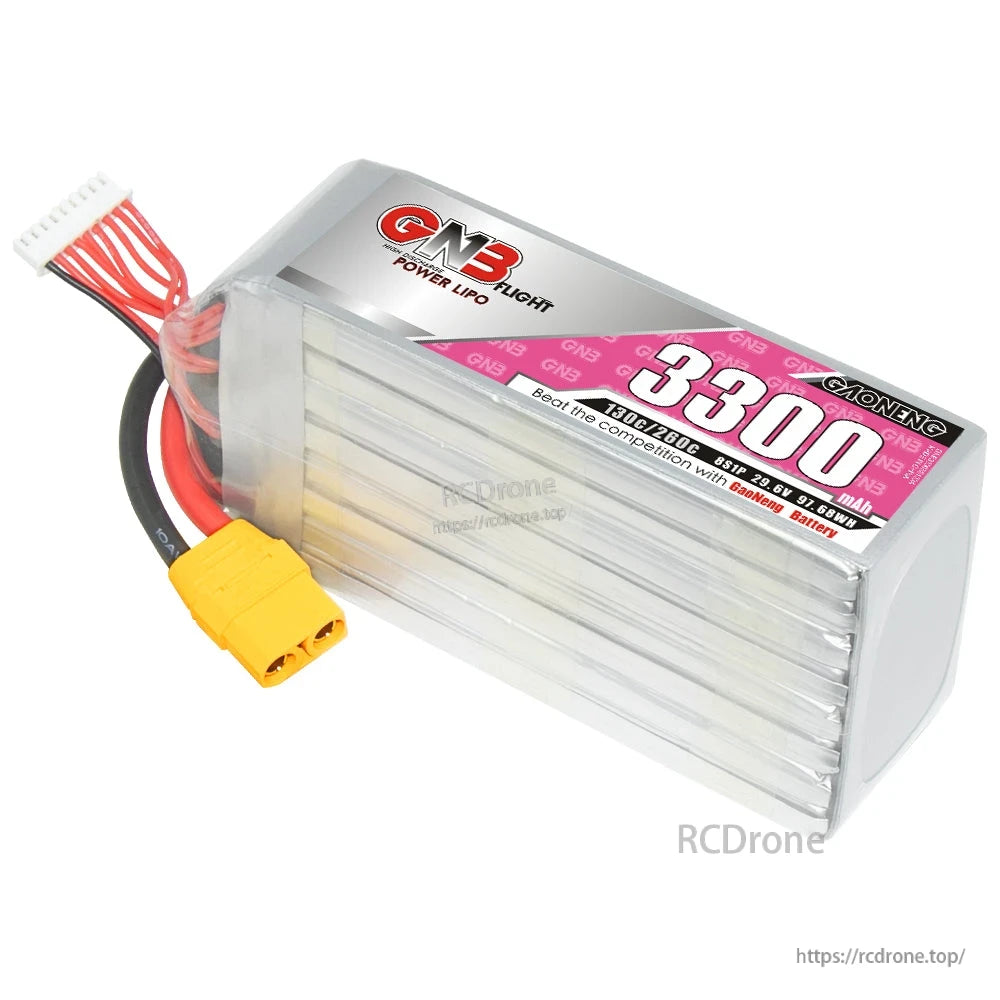 Angled view of GNB 3300 LiPo pack showing silver case, pink label, XT90 plug and balance lead