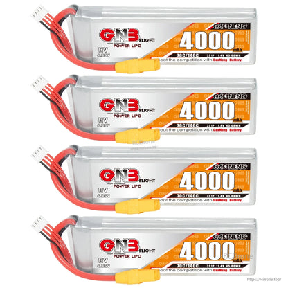 Four GNB 4000mAh LiHV LiPo batteries stacked, showing front labels and balance leads