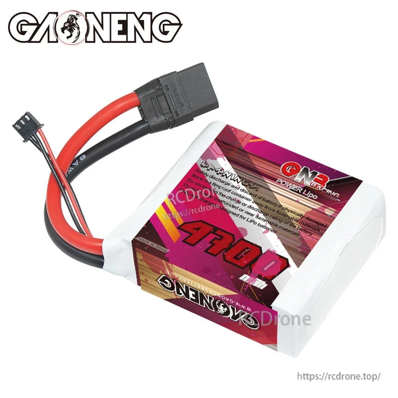 Angled rear view of GAONENG GNB 4700mAh LiPo battery showing warning/spec text label and XT90 plug