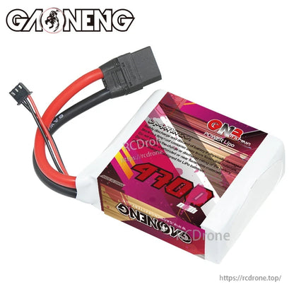 Angled rear view of GAONENG GNB 4700mAh LiPo battery showing warning/spec text label and XT90 plug