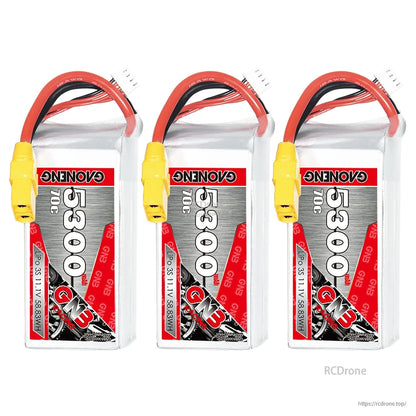 Three GNB 3S 5300mAh 70C LiPo batteries shown upright with XT90 connectors and balance leads