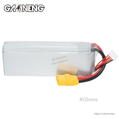 Rear side view of silver LiPo battery case showing XT90 plug and balance connector leads