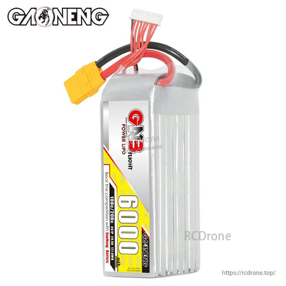 Upright view of GNB 8S 6000mAh LiPo showing label side, balance plug, and yellow XT90 connector