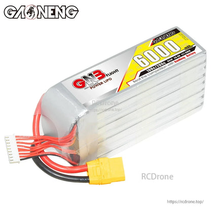 Angled end view of the LiPo pack showing wrapped end cap, thick discharge leads, and balance plug