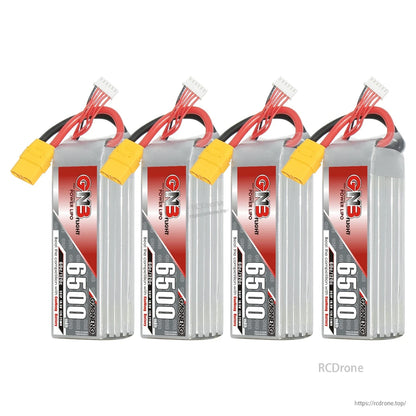Four GNB 6500 LiPo batteries in a row, showing labels, XT90 connectors, and balance plugs