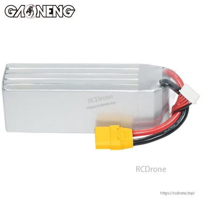 Side/back view of silver LiPo pack showing heatshrink wrap, XT90 plug, and balance connector
