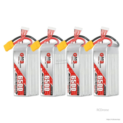 Four GNB 6500 battery packs lineup with XT90 connectors, shown upright on white background