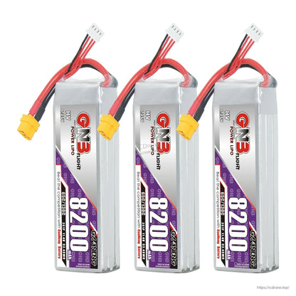 Three-pack display of GNB 8200 HV batteries standing upright with XT60 leads