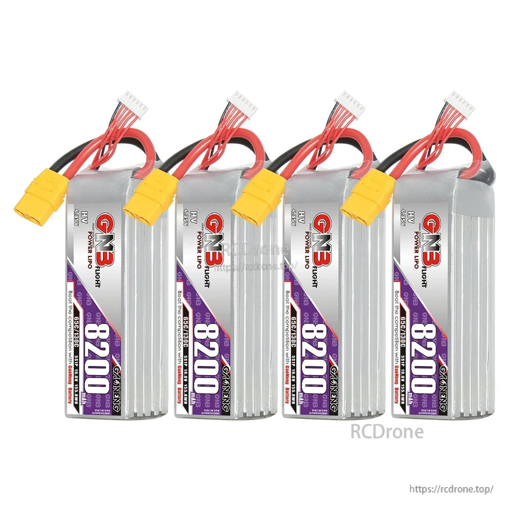 Four GNB 8200mAh HV LiPo batteries lined up, upright view with XT90 connectors and balance leads
