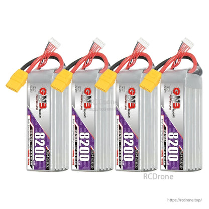 Four GNB 8200mAh HV LiPo batteries lined up, upright view with XT90 connectors and balance leads