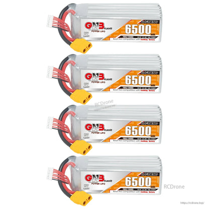 Four GNB 6500mAh 6S LiHV LiPo battery packs stacked, showing labels, XT90 connectors, and balance leads