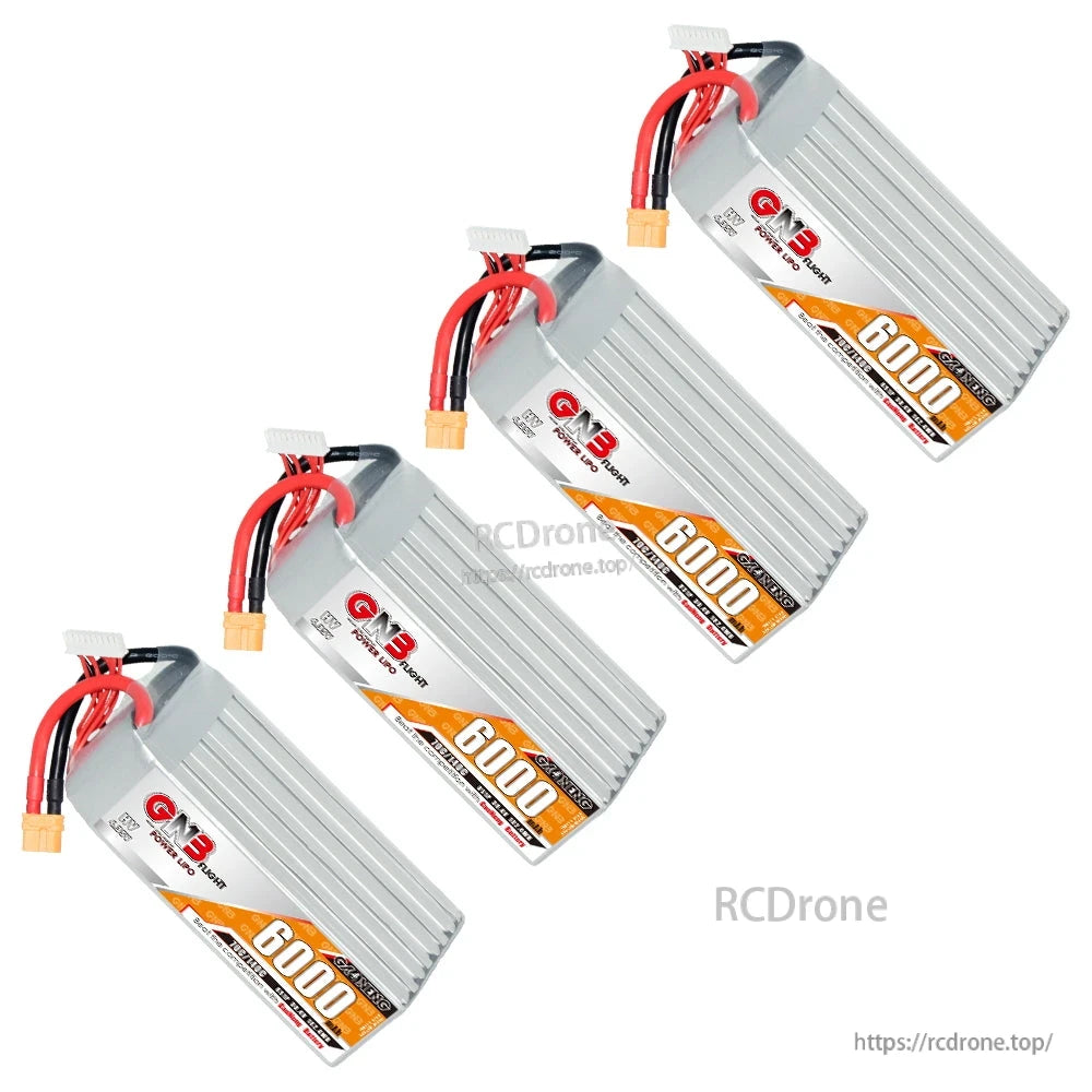 Four GNB HV 8S 6000mAh batteries shown in a diagonal layout with XT60 leads