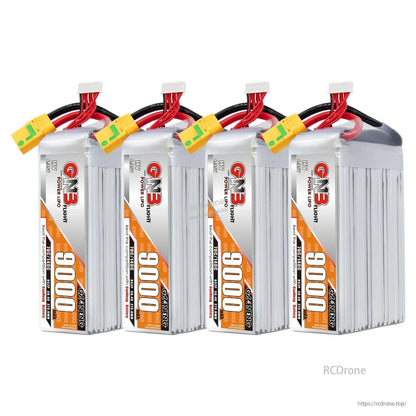 Four GNB 9000mAh HV LiPo packs standing upright side-by-side with XT90S connectors on top