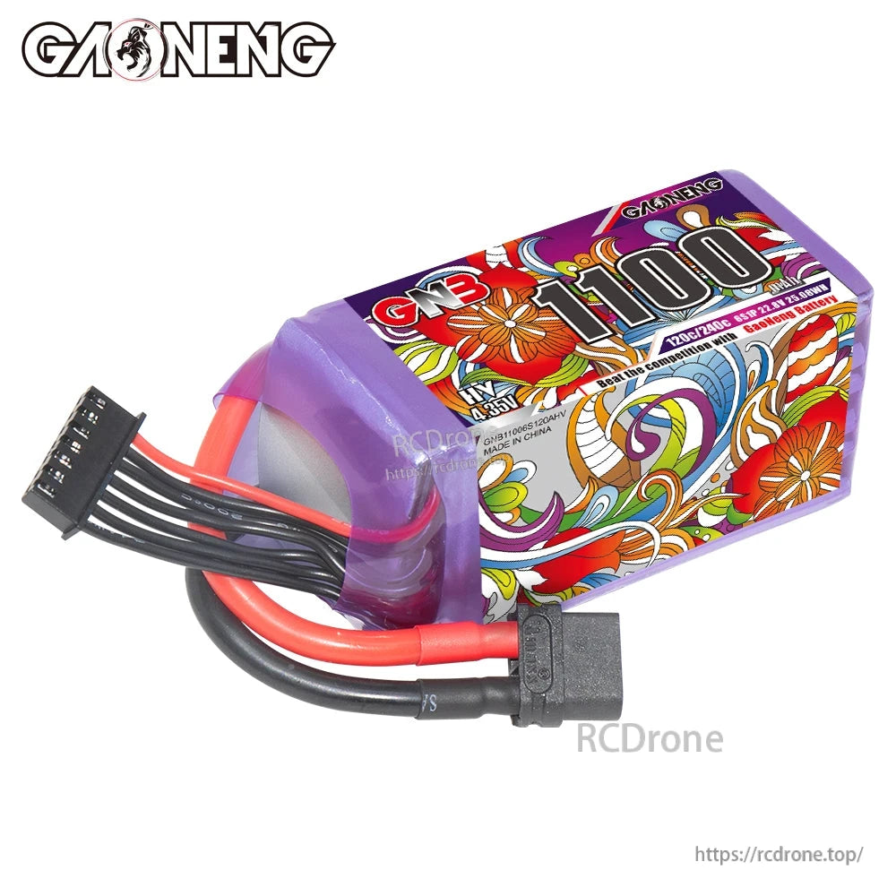 Angled side view of purple shrink-wrapped GNB 1100 LiHV pack showing power lead, balance lead and end cap