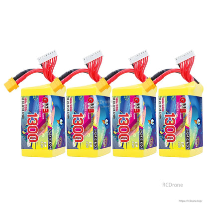 Four-pack bundle view of yellow 1300 batteries lined up with XT60 connectors