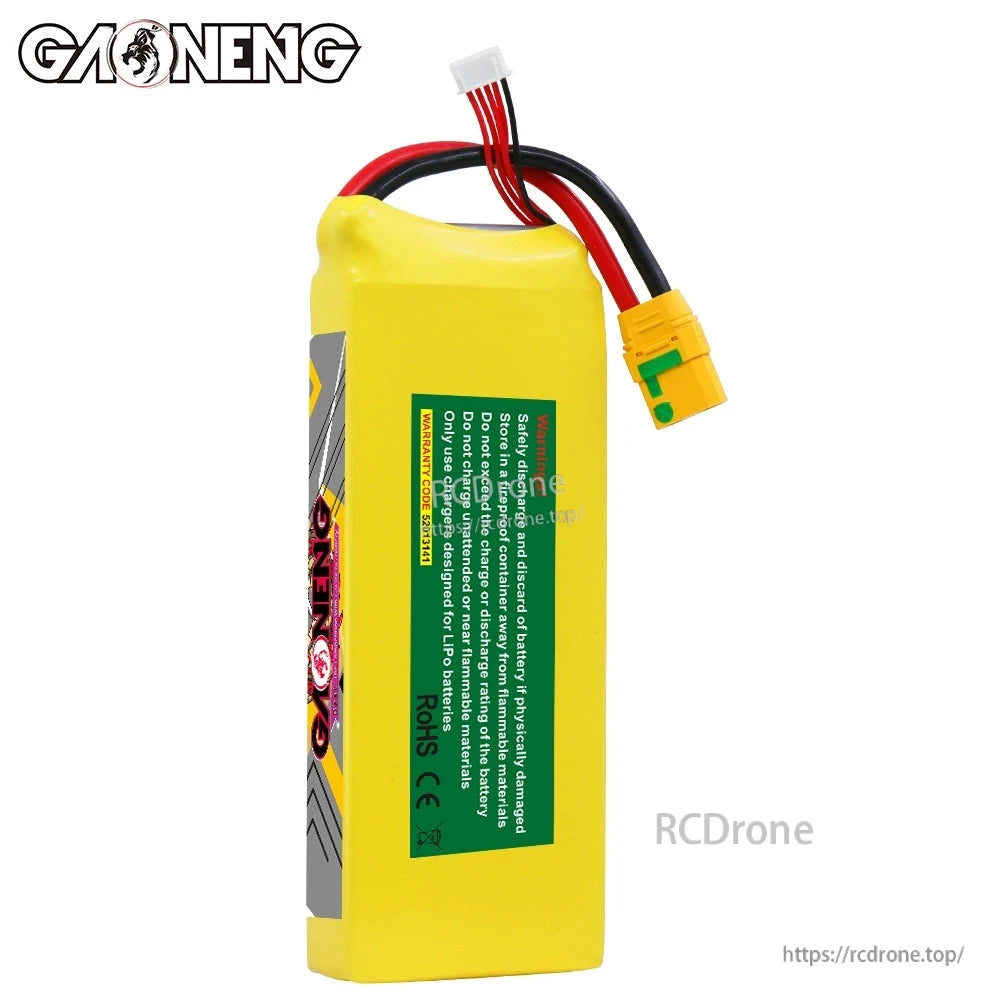 Rear view of battery showing green safety label panel, wiring, XT90S connector, and balance lead