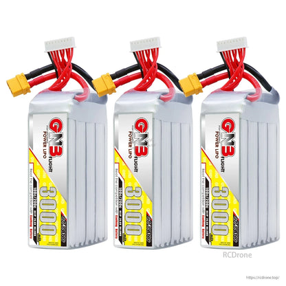 Three GNB 3000mAh LiPo batteries lined up, each with XT60 connector and balance lead