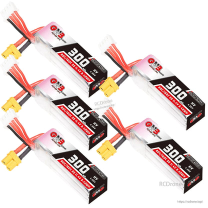 Four GNB 300mAh LiHV batteries arranged diagonally, showing XT30 power plugs and balance leads