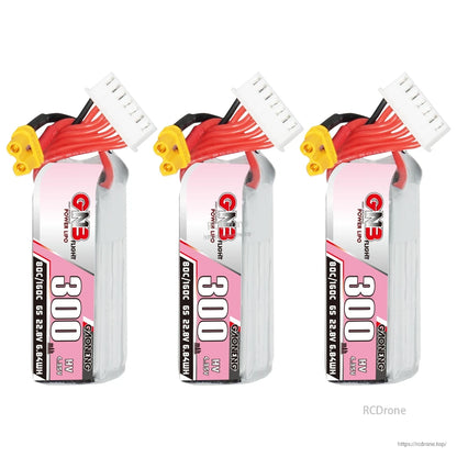 Three GAONENG GNB 300mAh HV 6S batteries shown upright with balance plugs and XT30 leads