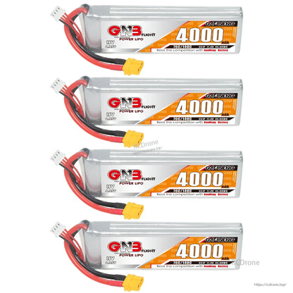 Four GNB 4000mAh LiHV LiPo batteries stacked, each with yellow XT60 connector and balance lead