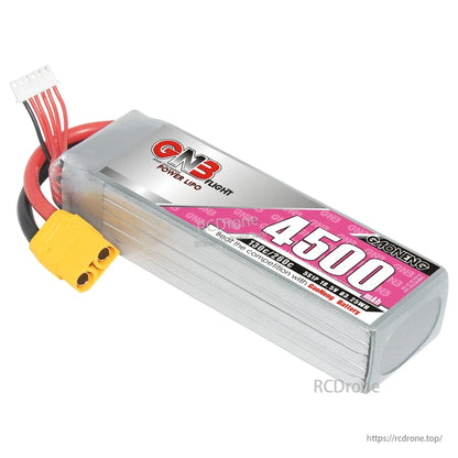 Angled view of GNB 4500 LiPo battery showing front label, ribbed aluminum case, XT90 and balance lead