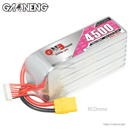 Angled rear-end view of GNB 4500 LiPo showing rounded end cap, balance lead, and XT90 plug