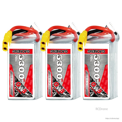 Three GAONENG 5300mAh 70C LiPo batteries upright, showing front labels and XT90 connectors