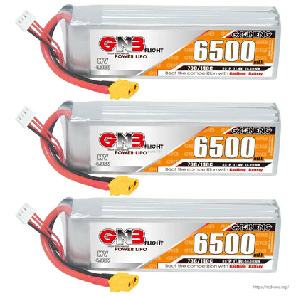 Three GNB 6500mAh 3S HV LiPo batteries lined up, side label view with XT60 connectors