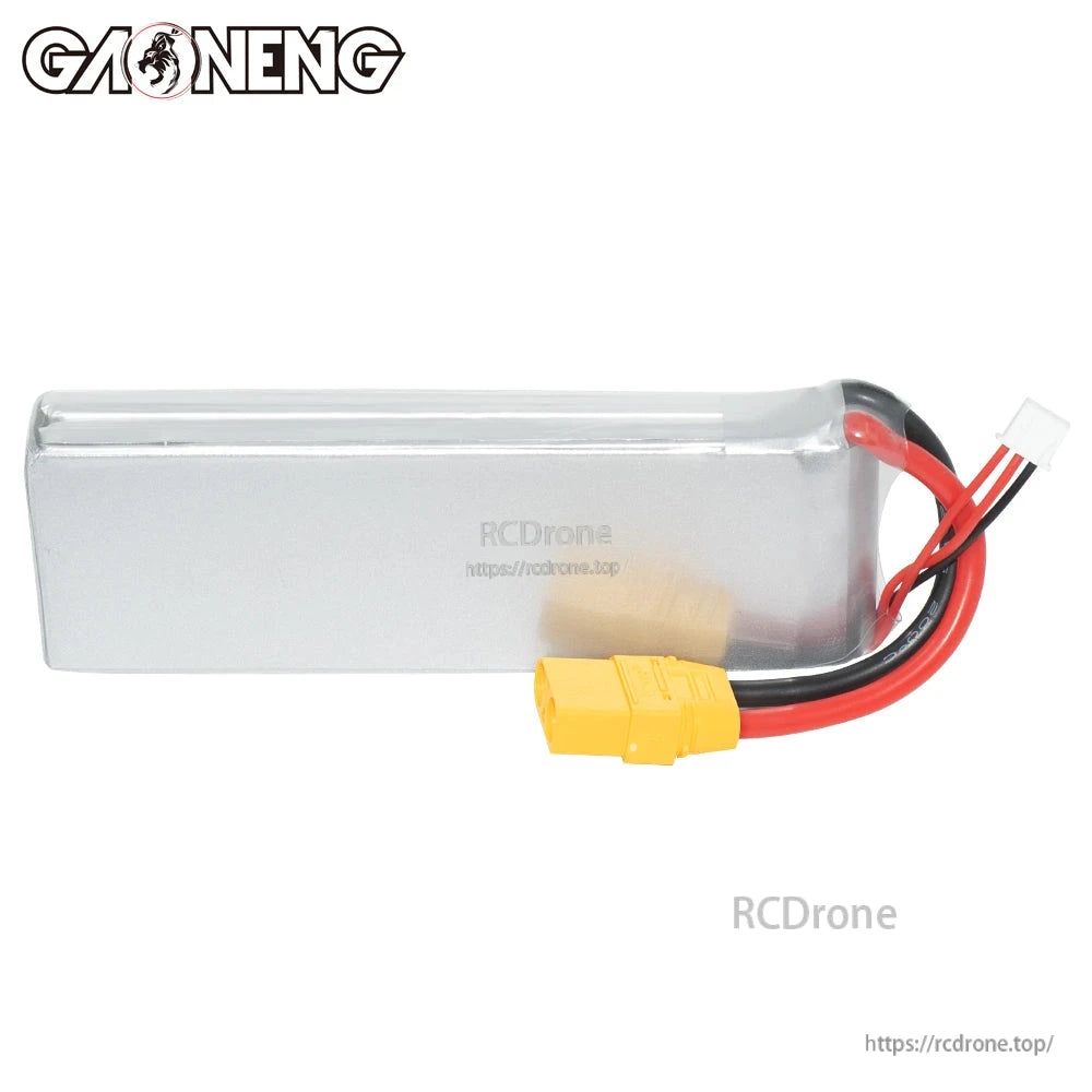 Rear side view of silver hardcase LiPo pack showing wire exit, XT90 connector, and balance plug
