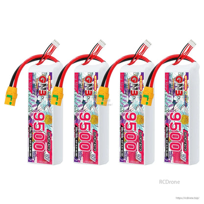 Four GNB 9500mAh LiHV battery packs displayed in a row, showing labels and XT90S connectors