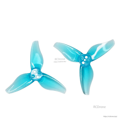 Two blue 3-blade drone propellers set, translucent finish, top view
