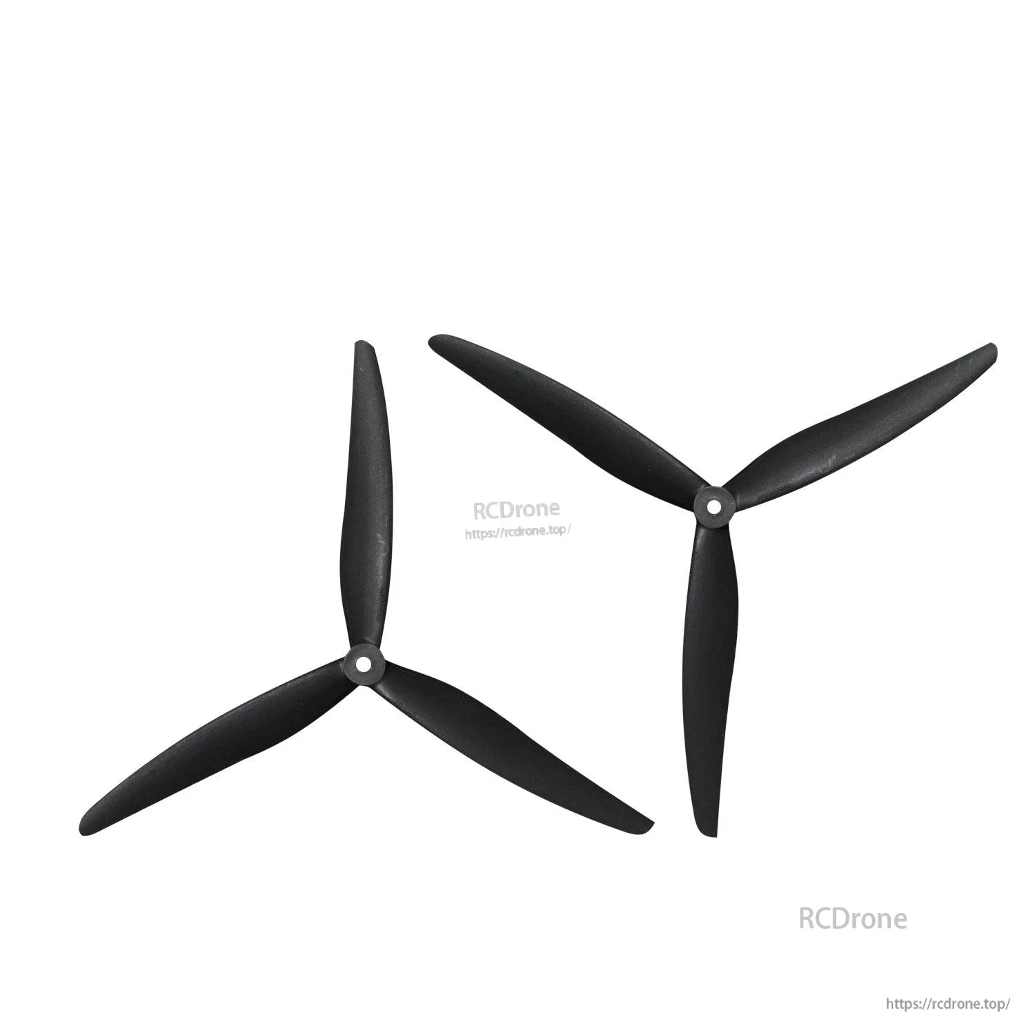 Two tri-blade propellers in alternate orientations, showing blade pitch and hub detail