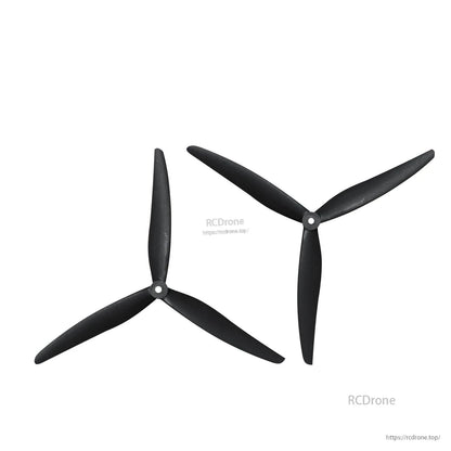 Two tri-blade propellers in alternate orientations, showing blade pitch and hub detail
