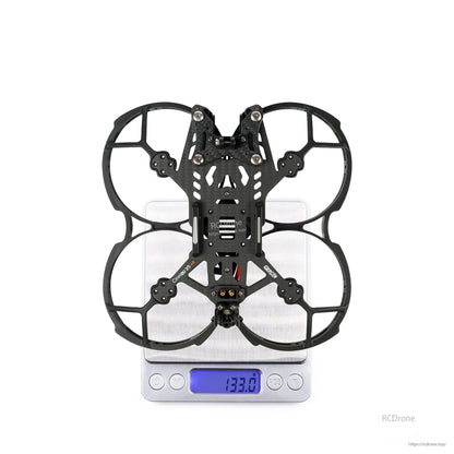 GEPRC GEP-CL35 V2 FPV Frame, GEPRC CineLog35 V2 3.5-inch FPV frame with prop guards, shown on a digital scale reading 133.0 g