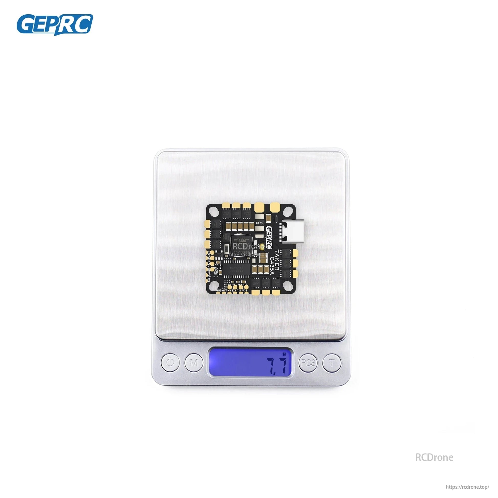 GEPRC GEP-TAKER G4 35A AIO flight controller on a digital scale, showing 7.7 g and a USB-C port