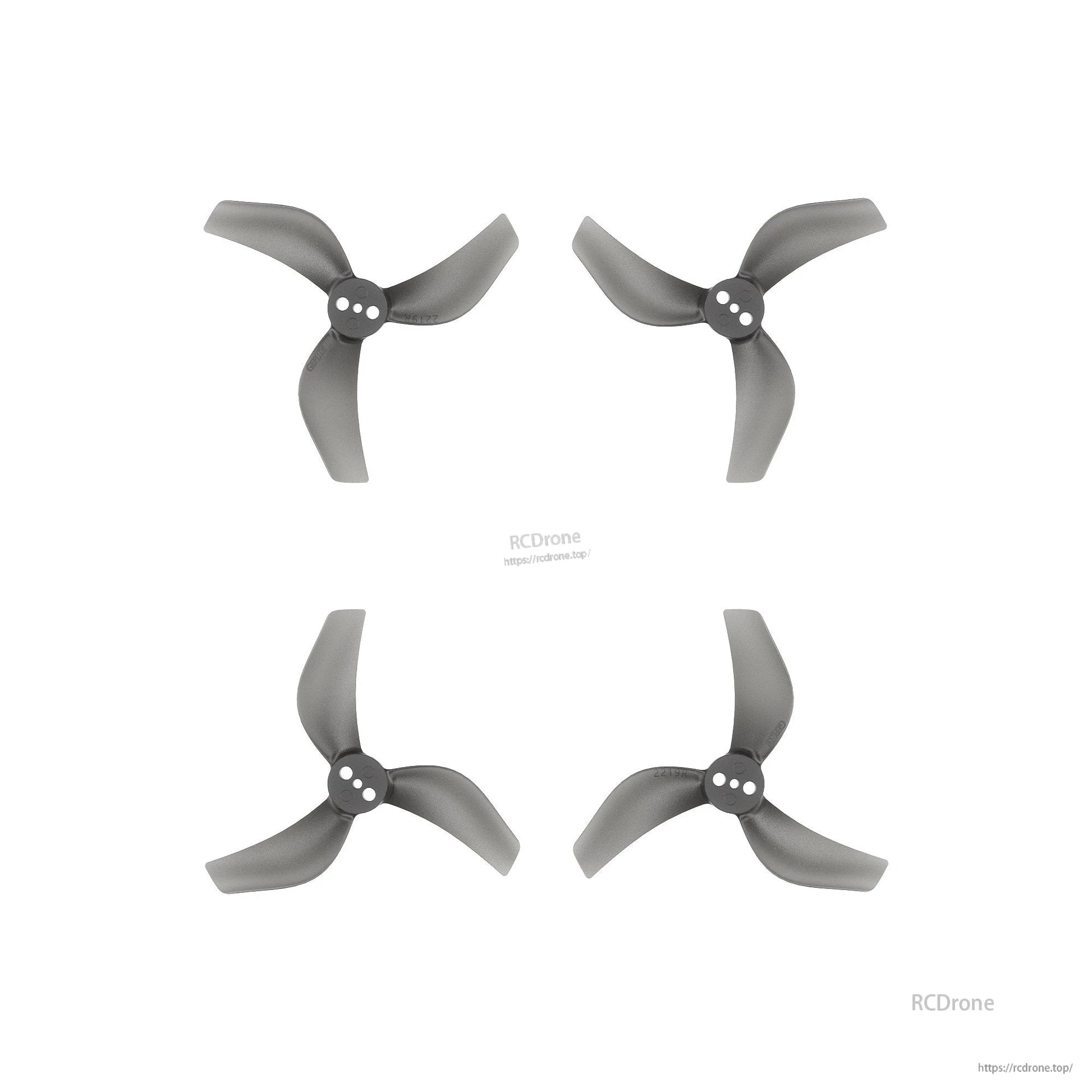 Set of four grey three-blade drone propellers with three-hole hubs, arranged on a white background