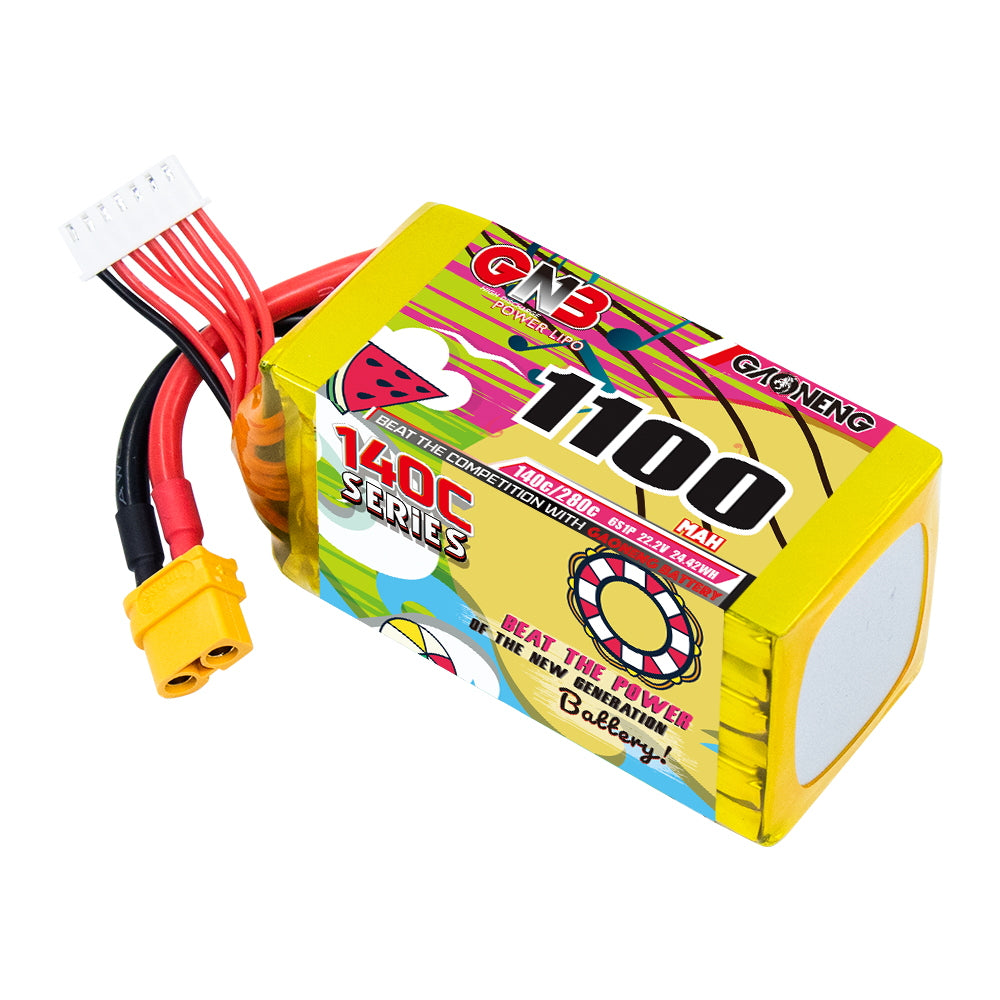 Angled view of GNB 1100mAh 6S LiPo battery showing 140C label and XT60 plug with balance connector