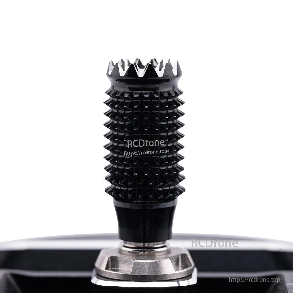 Macro view of the gimbal stick grip, knurled texture and serrated top cap