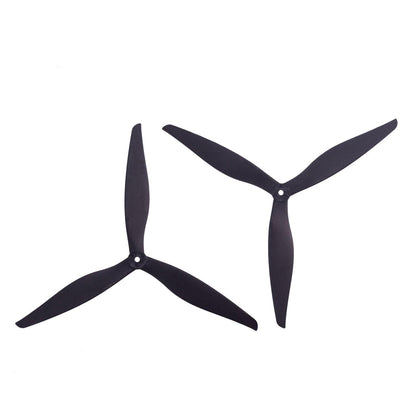 Pair of black tri-blade drone propellers, two-piece set shown side by side