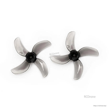 Smoky gray 31mm 4-blade propeller pair with black hub, top view