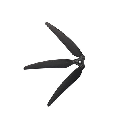 Side-angled view of black folding 3-blade propeller showing blade profile and hub