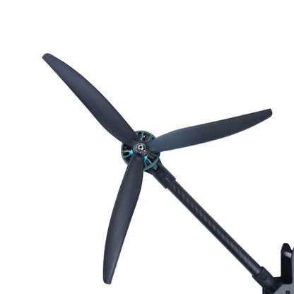 13-inch Gemfan 1309-3 tri-blade propeller installed on motor and carbon arm, close-up